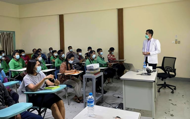 Dr Zaw giving a health talk in a room