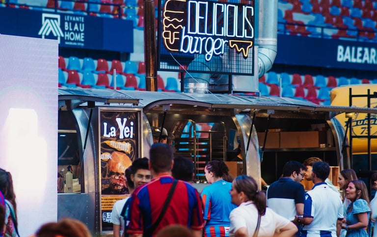 a group of people sitting at tables in a restaurant