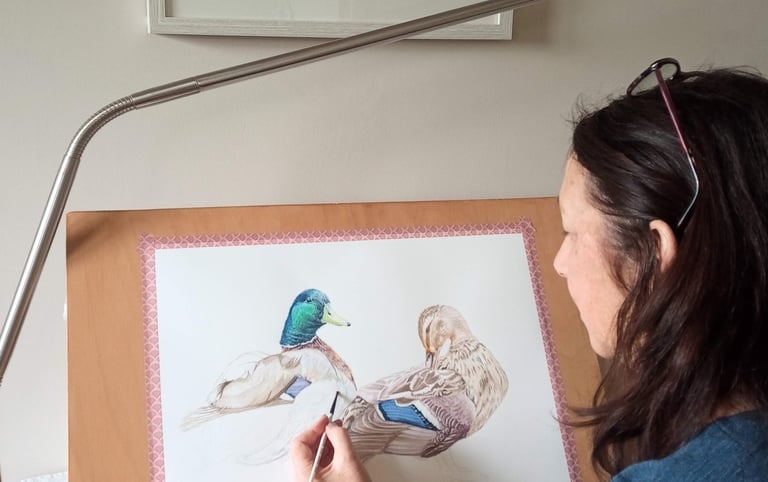 Artist painting ducks