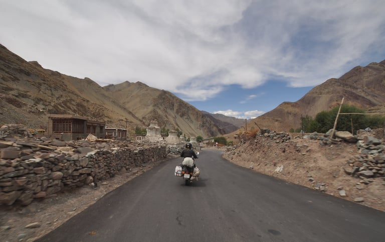 Tracey Billington riding the Leh to Manali highway over the great Himalayan range, Ladakh, India 