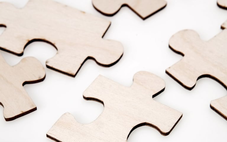 Image of wooden jigsaw puzzle pieces to represent fractional services