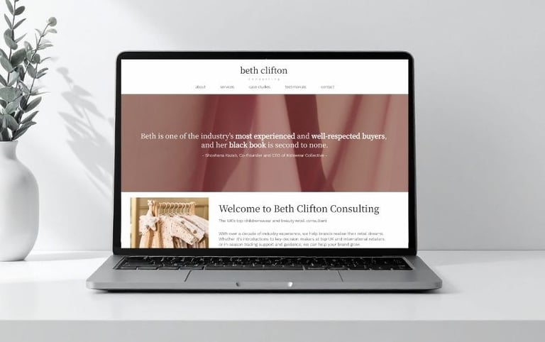 Photo of laptop screen showing Beth Clifton Consulting's homepage