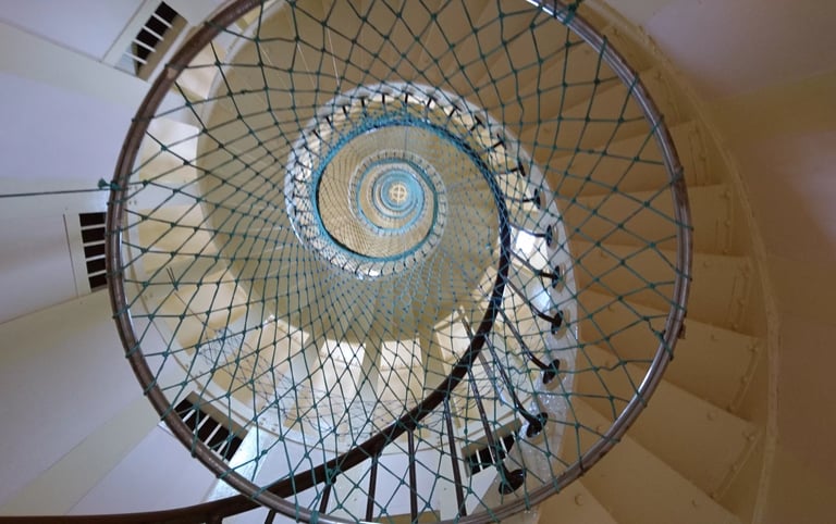 a spiral staircase way with a spiral staircase