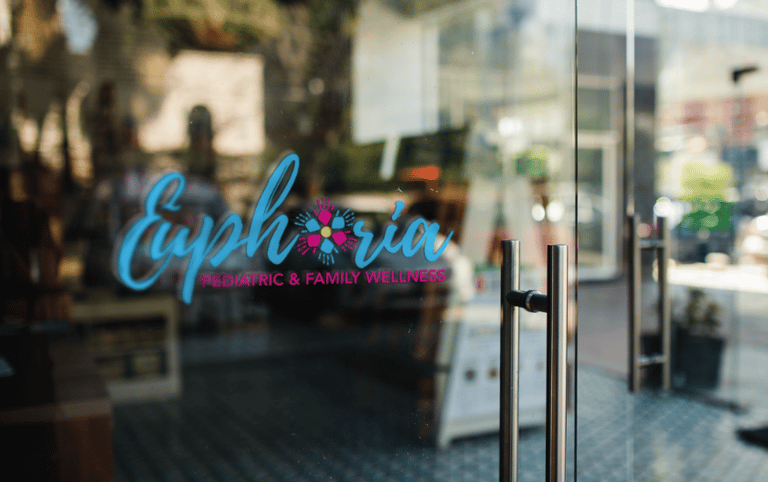 a glass door with a sign that says caprico