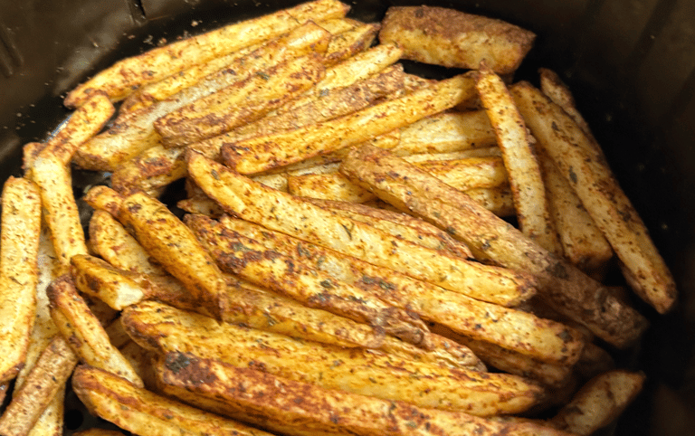 Seasoned air fryer fries, cooked and ready to eat.