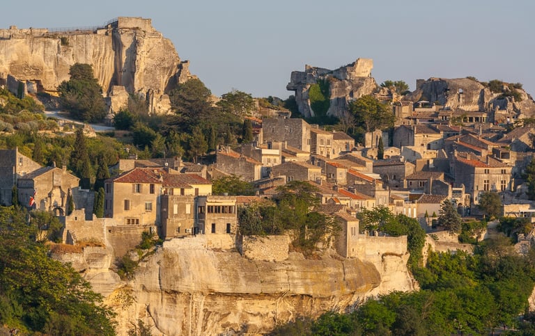Panoramic view of the medieval hilltop village Les Baux-de-Provence in France at sunset.