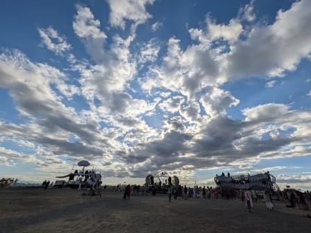 a group of people standing around a large group of people