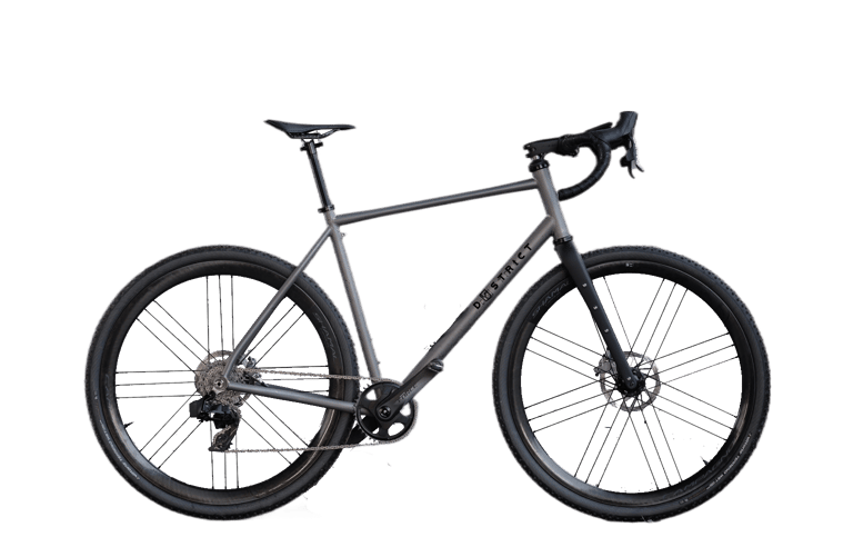 Custom grey gravel bike with carbon wheels and disc brakes Dystrict Titanium.