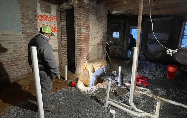 a man in a construction site with a helmet on