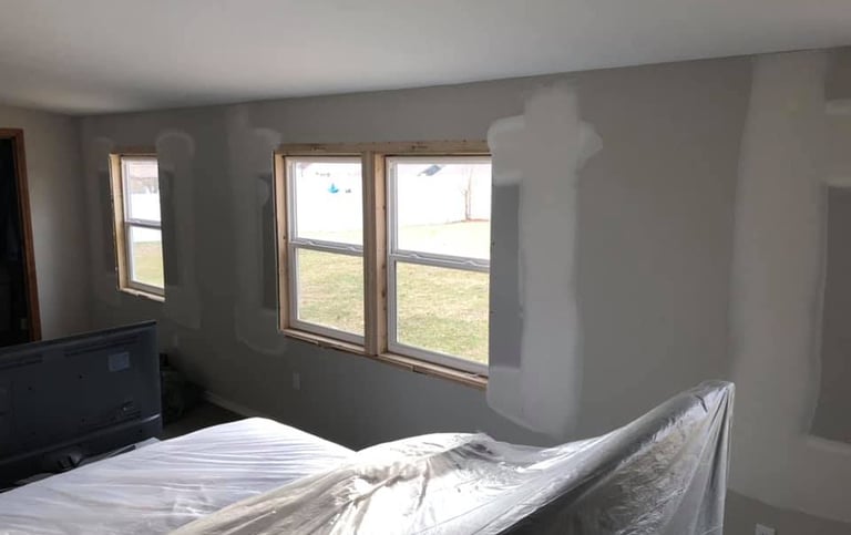 The  windows were removed and drywall has been repaired filling in the hole
