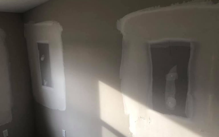 The windows were removed and drywall has been repaired filling in the hole