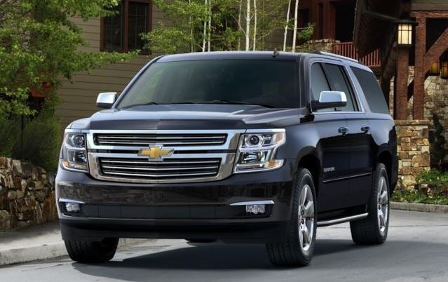 Black Chevy Suburban luxury SUV used for premium transportation services.