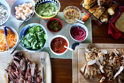 taco feast, beef, chicken and shrimp with many toppings