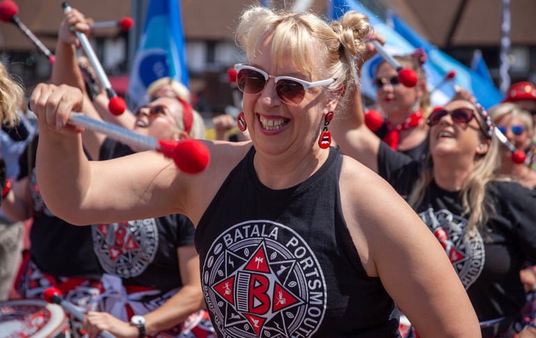 Batala Band team member in action