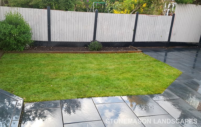 Grey sandstone circle paving slabs with charcoal edging