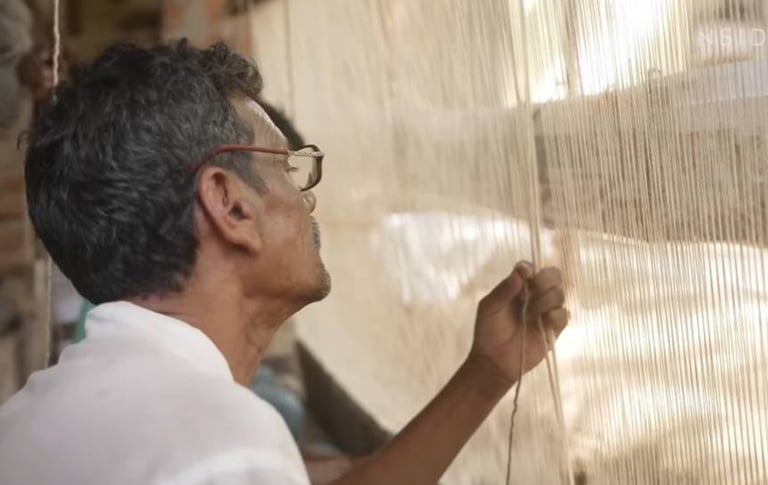 Artisan handknotting a rug in Bhadohi, India