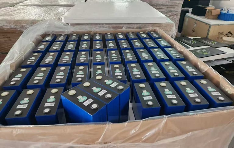 boxes of LiFePO4 prismatic battery cells in a warehouse