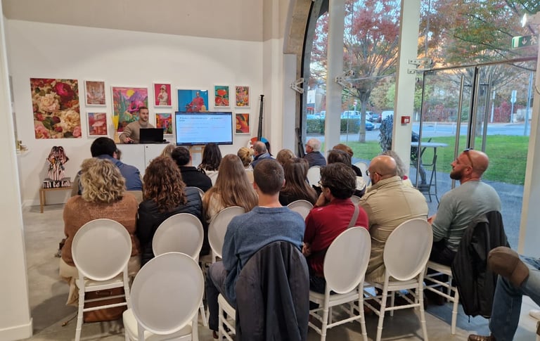 a group of people sitting in chairs in a room