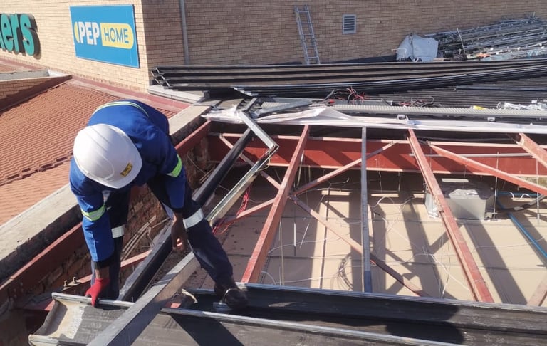 Environmental Pro Construction team replacing a roof structure on a commercial building in West Rand