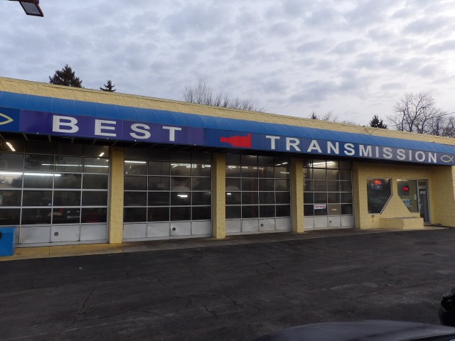 Exterior of Best Transmission auto repair shop showing service garage bays and office entrance.