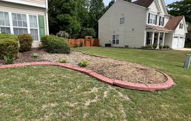 Flower bed that had a large tree removed that we then redesigned as shown in other pictures.
