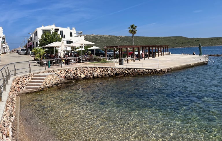 Royal Enfield motorcycle tour stoping at a restaurant in Menorca