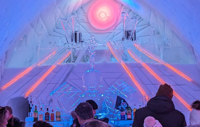 ice hotel evening with people gathered around the bar