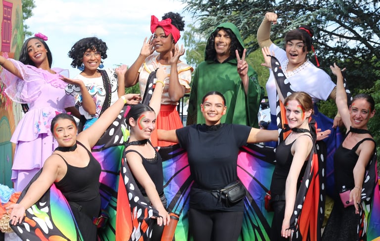 Encanto Familia posing for a photo at a parade