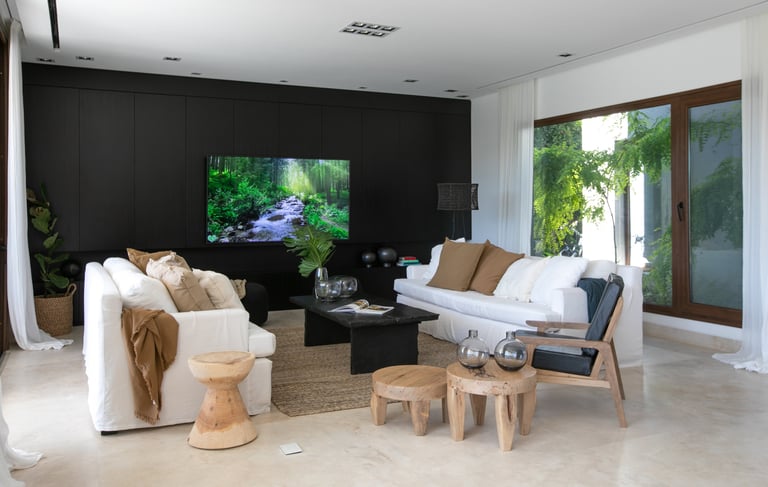 a living room with a television and a flat screen tv