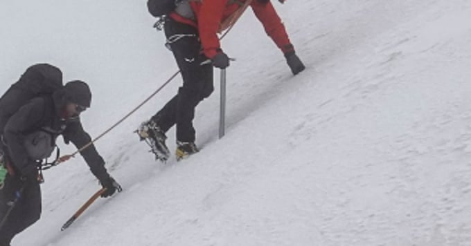 two climbers in the snow, mountain guide and coach, mist, ice