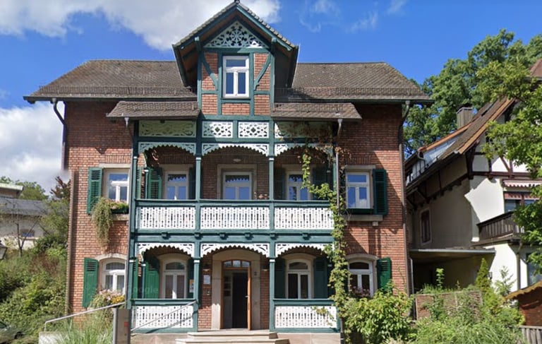 a large house with a brick building and a brick building