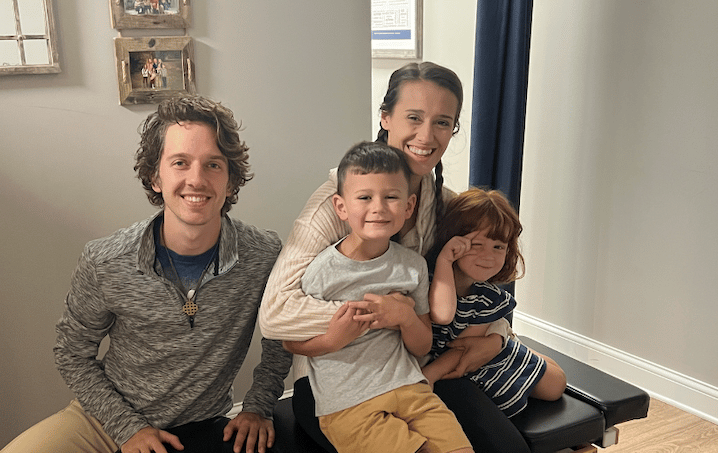 Happy family smiling after gentle chiropractic adjustment in Franklin TN