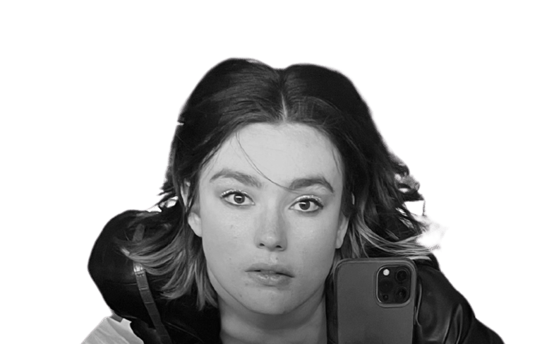 a woman holding her iphone taking a selfie