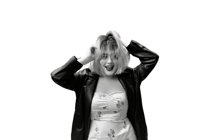 a woman in a white dress and black jacket