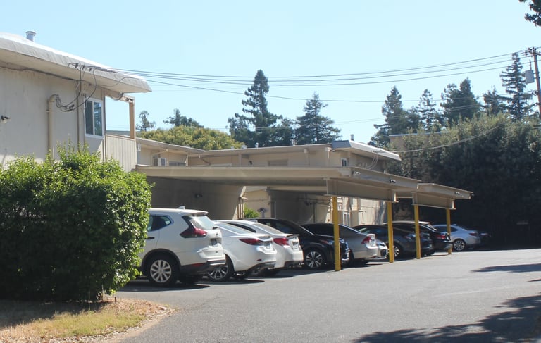 cars in off street parking lot at university commons apartments