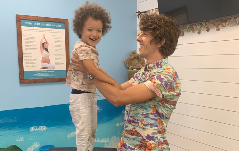 Child relaxed and smiling during pediatric chiropractic visit in Franklin Tn