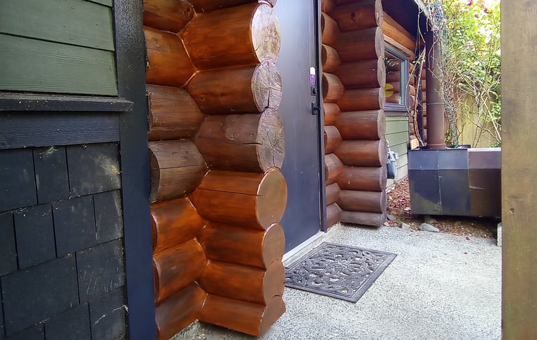 log home chink and staining by Vancouver Island log house restoration company Embassy Restorations