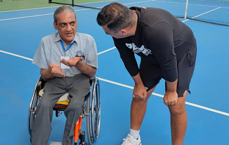 Wheelchair athletes and tennis players working wtih Cesar Performance Coach