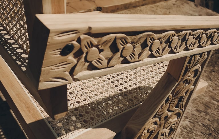 Contemporary chairs made of teak wood and rattan with a combination of distinctive carved ornaments