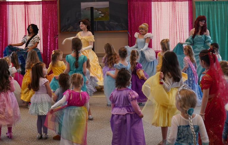 Princesses perform a dance at a ball
