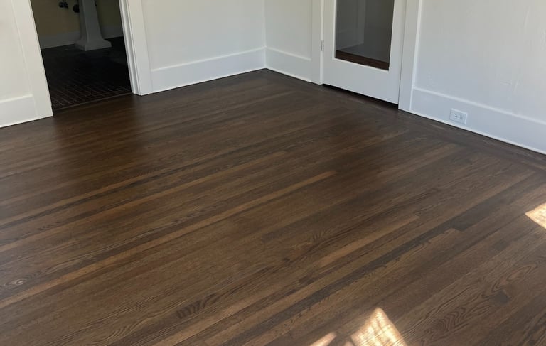 a room with a wooden floor and a door