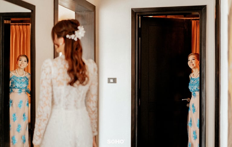 a woman in a white dress and a woman in a dress