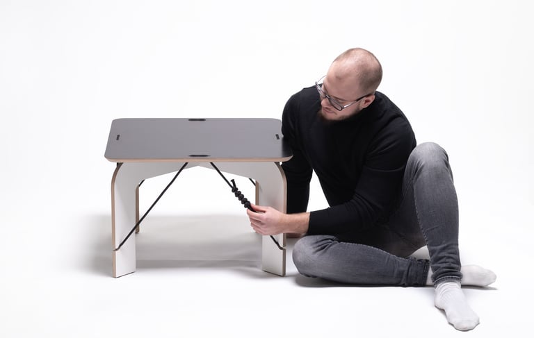 SOLIDO zero-waste coffee table: CNC-cut plywood sheet transforming into legs and tabletop with jute