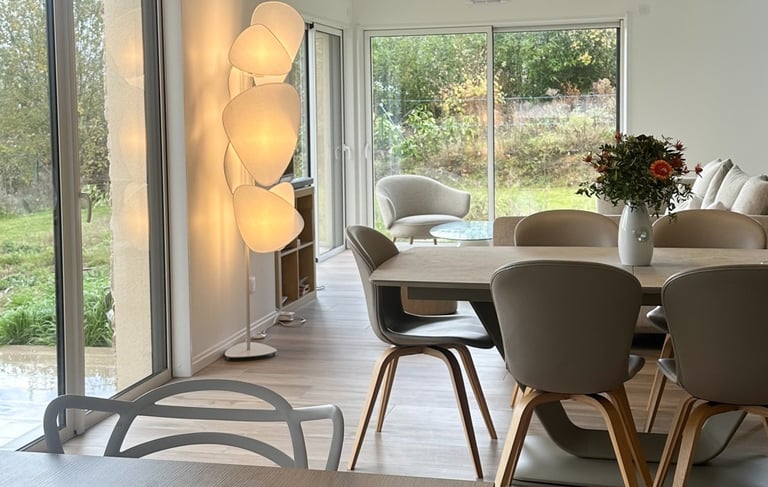 a dining room with a table and chairs