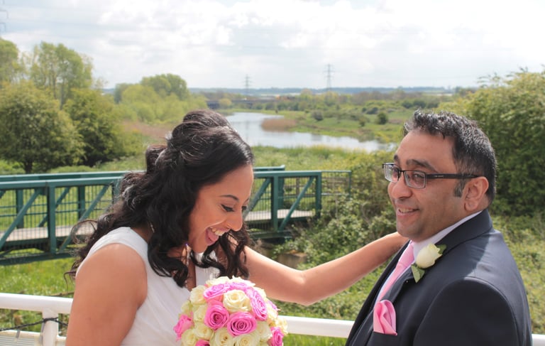 a bride and groom on the top deck of the ark northampton, with midsummer meadow nature reserve