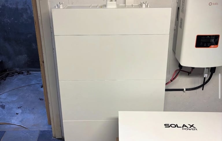 SolaX Power battery storage system and hybrid inverter installed in a residential utility room.
