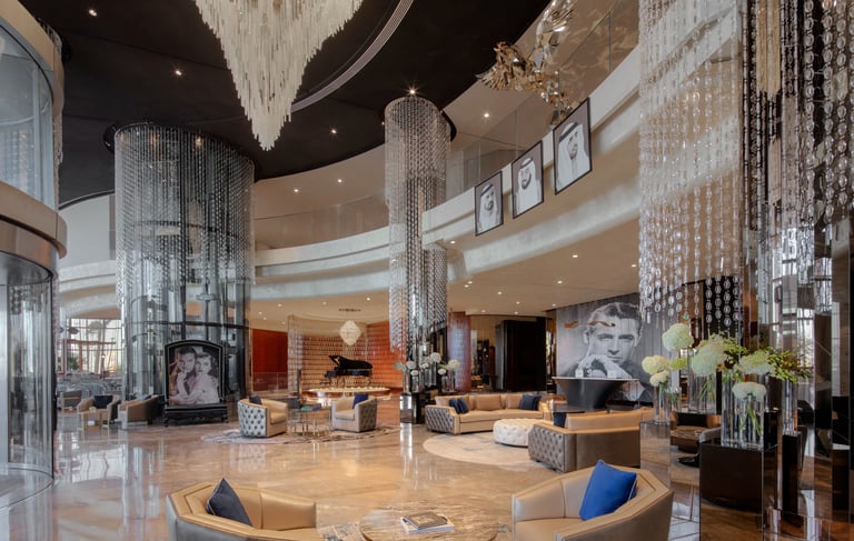 a large circular table with a glass chandelier