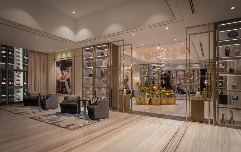 a living room with a couch and a glass wall