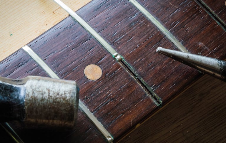 sideways fret extraction on a Fender neck