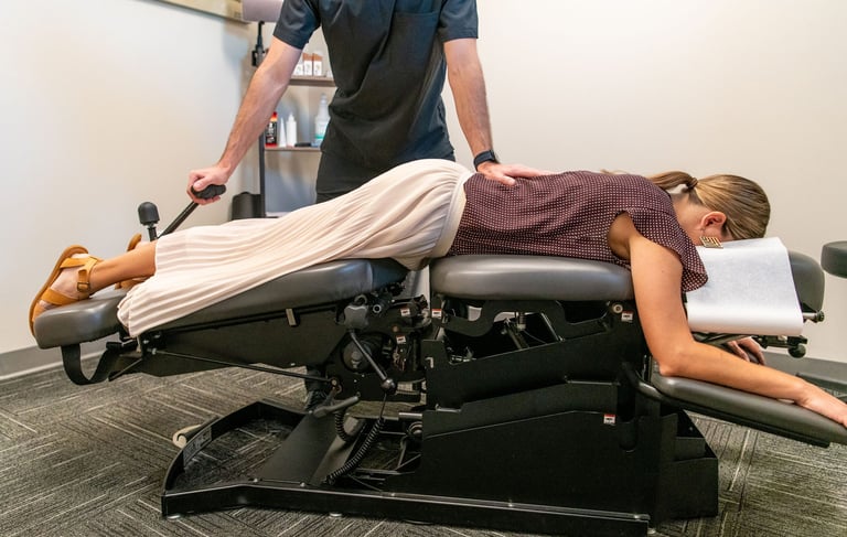 a woman is getting a chiropractic adjustment